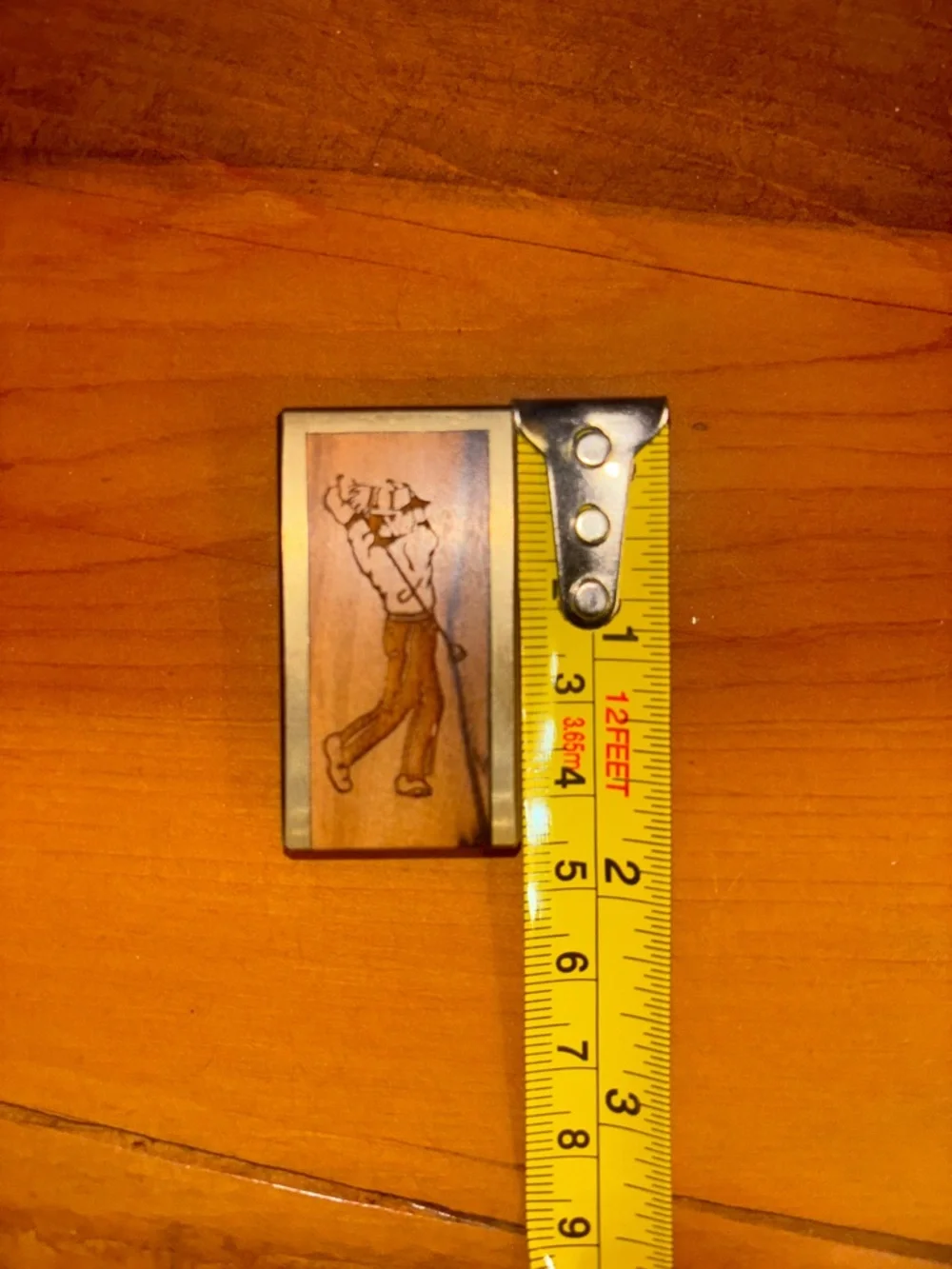 Vintage brass with wood inlay golfer money clip.